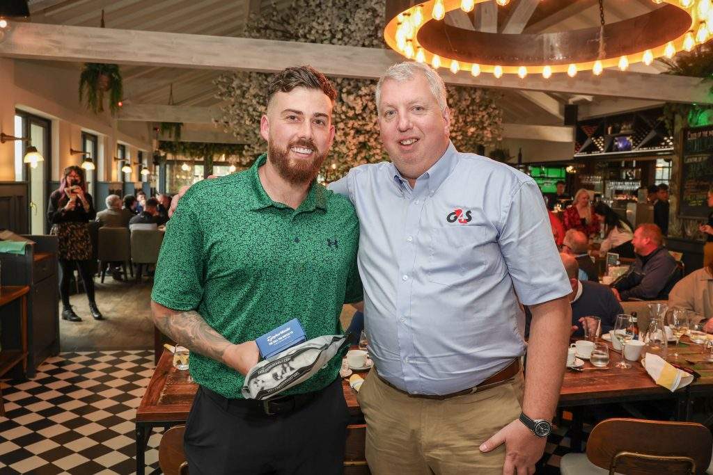 G4S's Kevin Scruby standing with a prize winner smiling at the camera