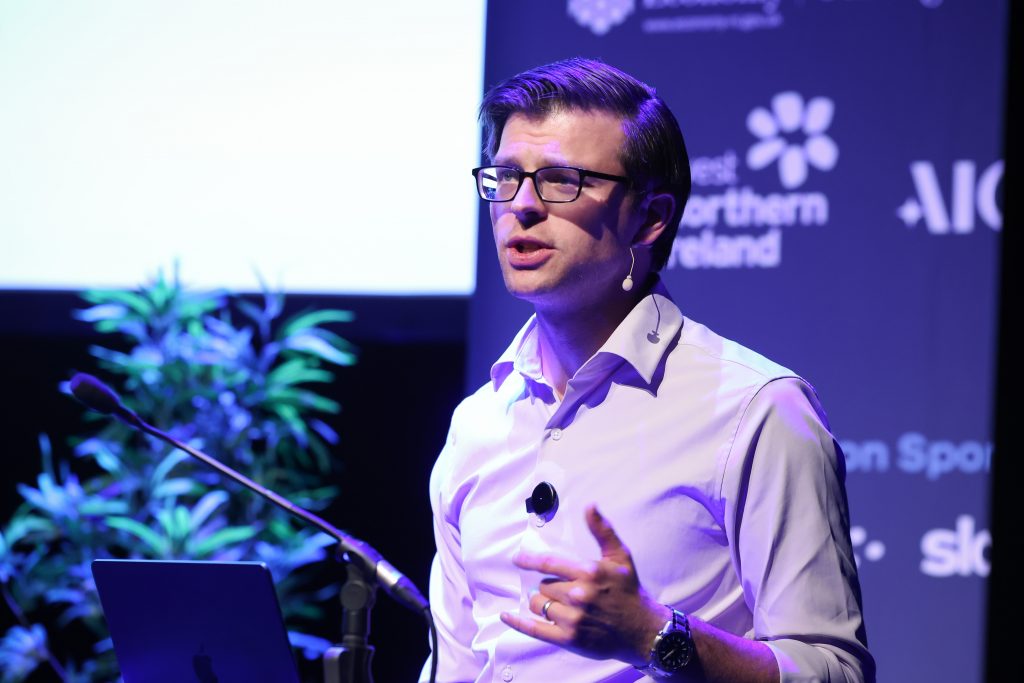 Paul Cheek speaking at the AI conference