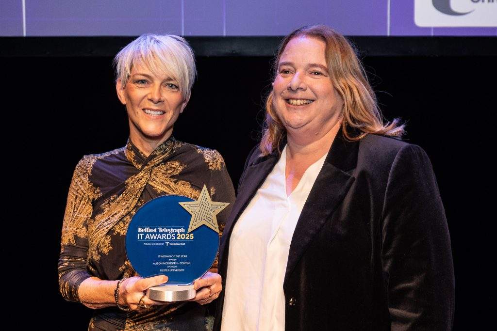 Elaine Smyth, Research Systems Manager, Ulster University, presents IT Woman of the Year, sponsored by Ulster University, to Alison McFadden from Continu, at the Belfast Telegraph IT Awards 2025 at the Mac in Belfast.