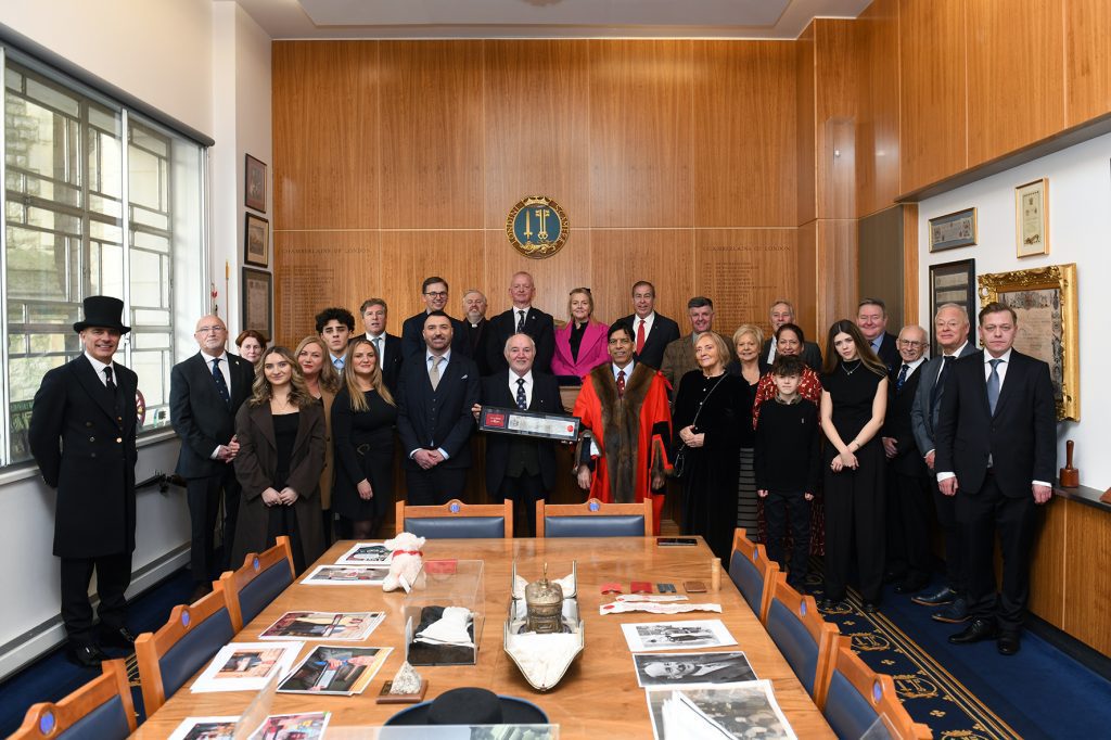 Dr Terry Cross OBE is pictured receiving the Freedom of the City of London, surrounded by his family, friends and colleagues.