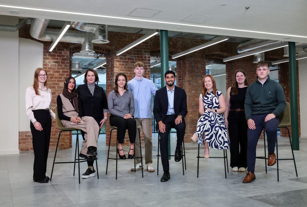 Deloitte’s 2025 intake of graduates and apprentices (L-R) Shannon Wilson, Aman Nisar, Rachel Scott, Adam McGarry, Usman Memon, Cora Lee and Ethan Donnelly with Marie Doyle, Office Senior Partner, Deloitte Northern Ireland and Grace Cartin, Partner, Deloitte Northern Ireland.  