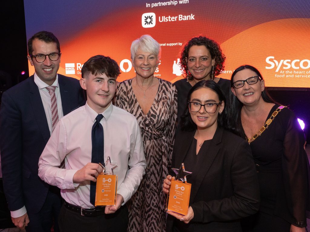 L–R Back Row: Richard Lusty, Relationship Director, Ulster Bank; event compere Pamela Ballantine; guest speaker Alex Polizzi; and Vicky Green, NIHF President. Front Row: Rising Stars from County Down – Daniel Rice, Food and Beverage Supervisor, Hillyard House Hotel; and Skye Cook, Duty Manager, Millbrook Lodge Hotel.