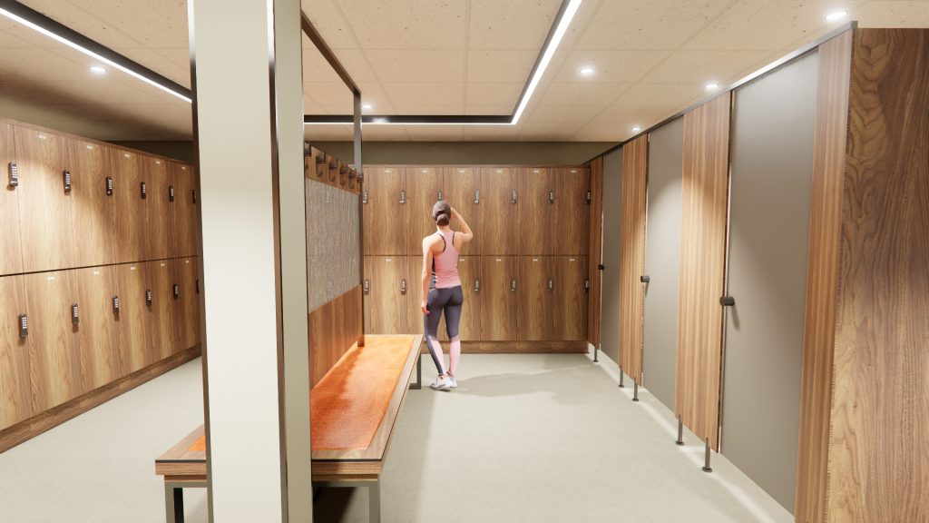 New changing rooms - light wooden lockers, wooden bench and a person standing in gym gear using the facilities