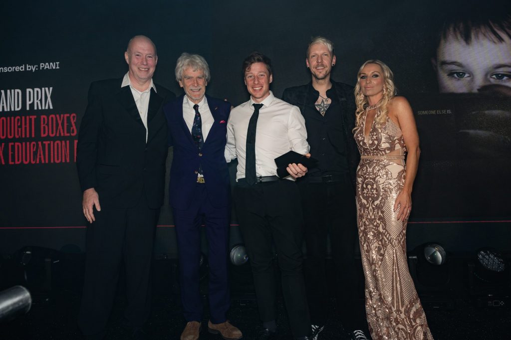 A photo from the night shows, left to right: Tom Notman (Executive Creative Director), Sir John Hegarty, Jamie Watson (Managing & Creative Director), Chris Cunningham (Designer) and Janine Wells (PANI Awards Chair).