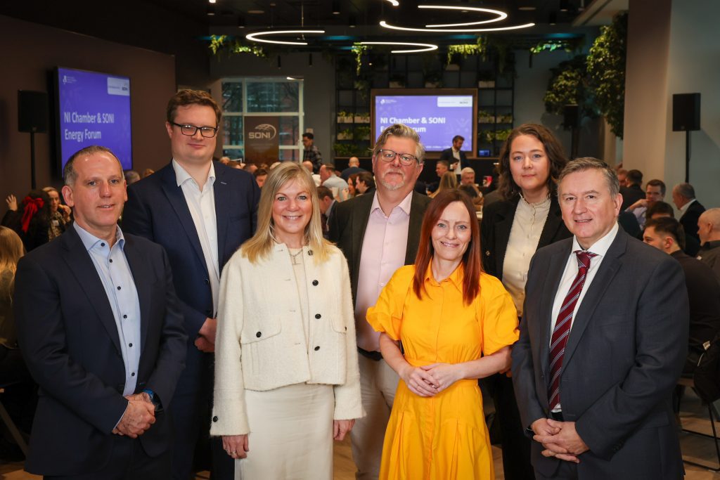  A group pose together at an energy forum event.
